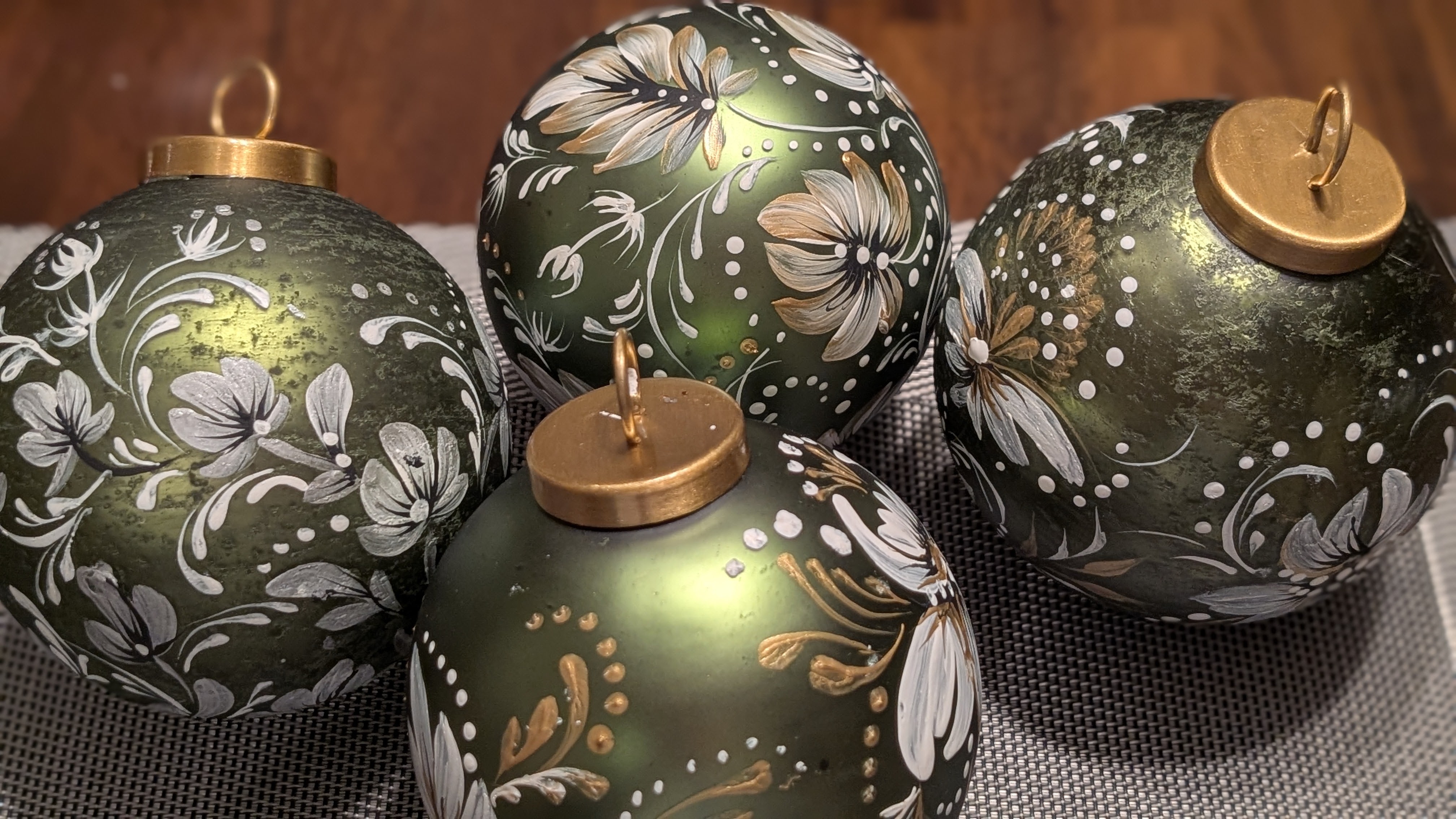 Collection of green ornaments with white florals