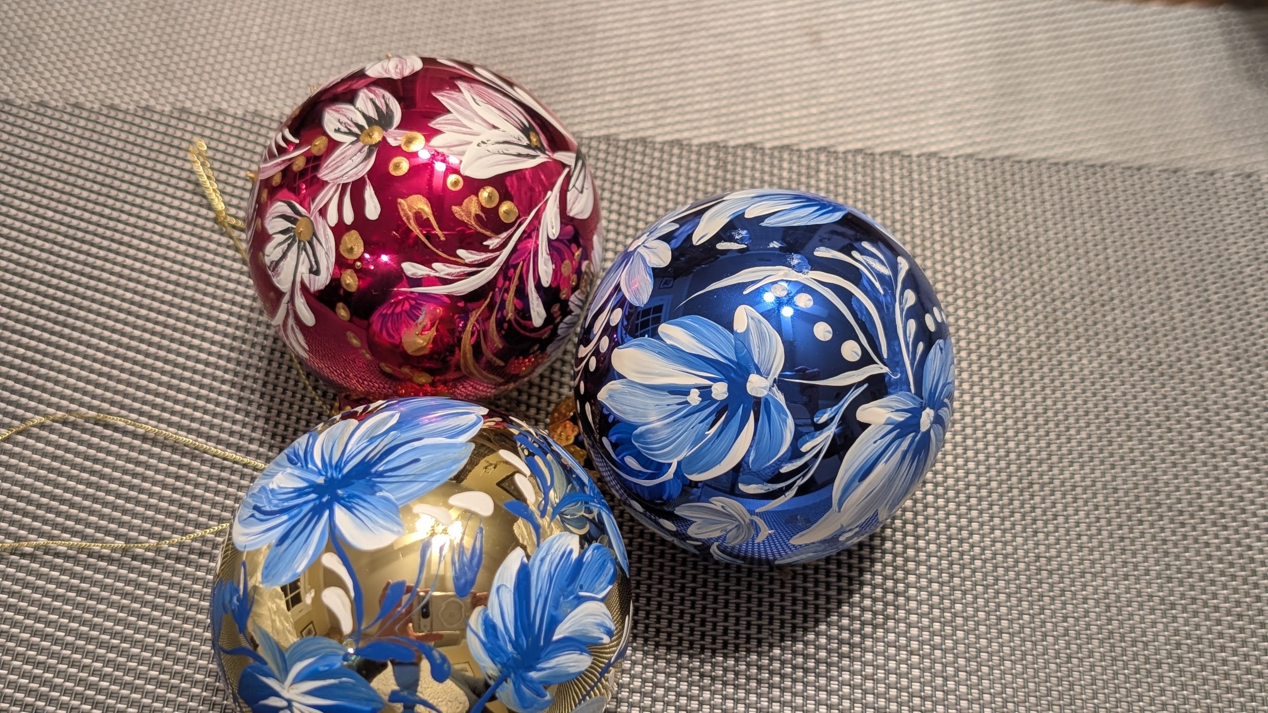 Blue and red ornaments with gold accents